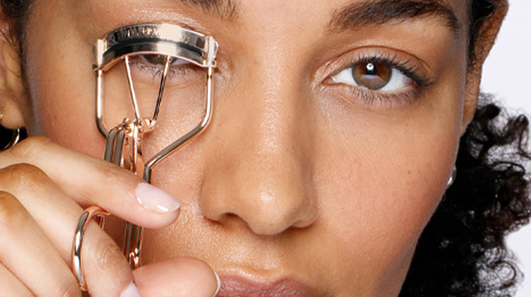 Model using classic eyelash curler