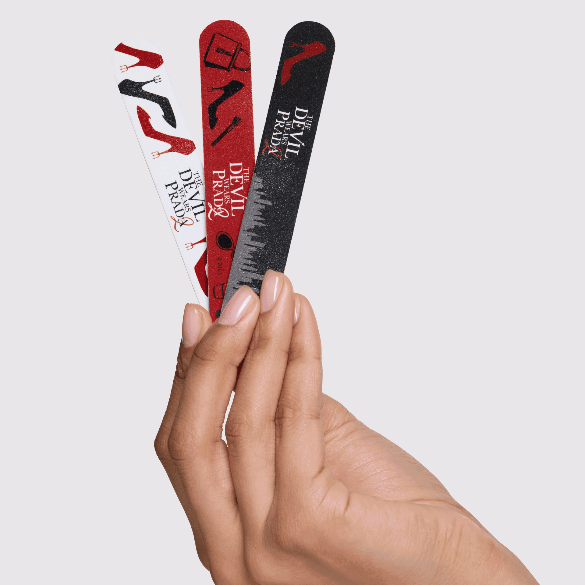 Model holding The Devil Wears Prada 2 Nail File Set
