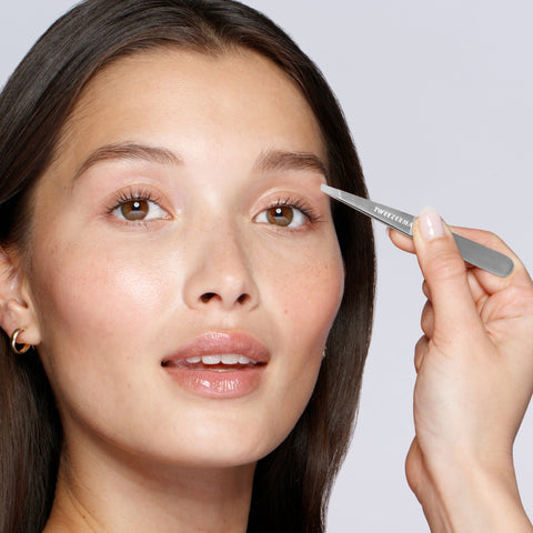 Model using Classic Stainless Steel Slant Tweezer