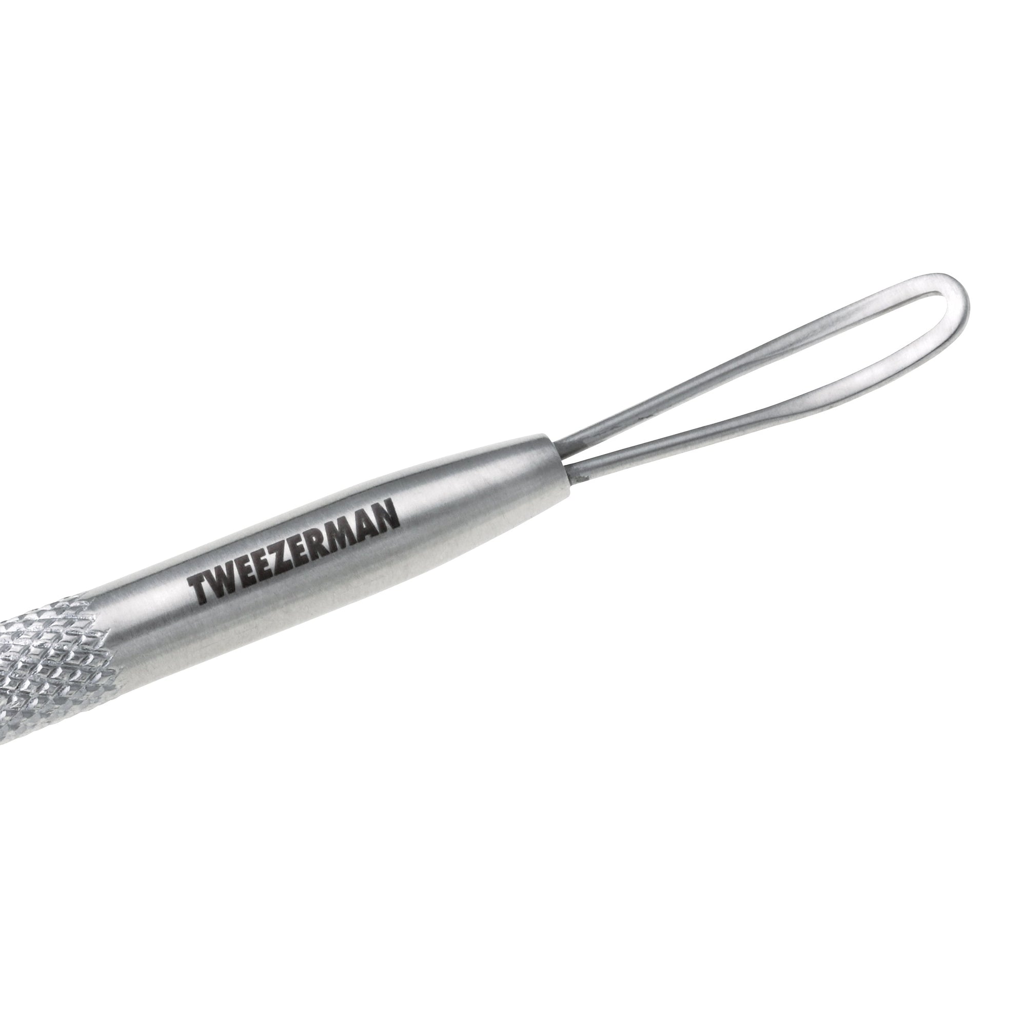 Extrémité longue et plate de l’outil de soins de la peau